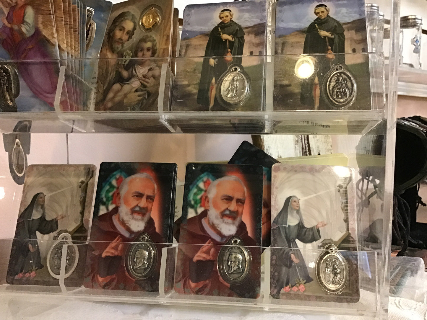 Laminated card with holy medal