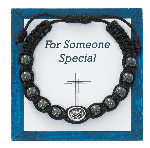 ST. MICHAEL HEMATITE CORDED BRACELET, CARDED.