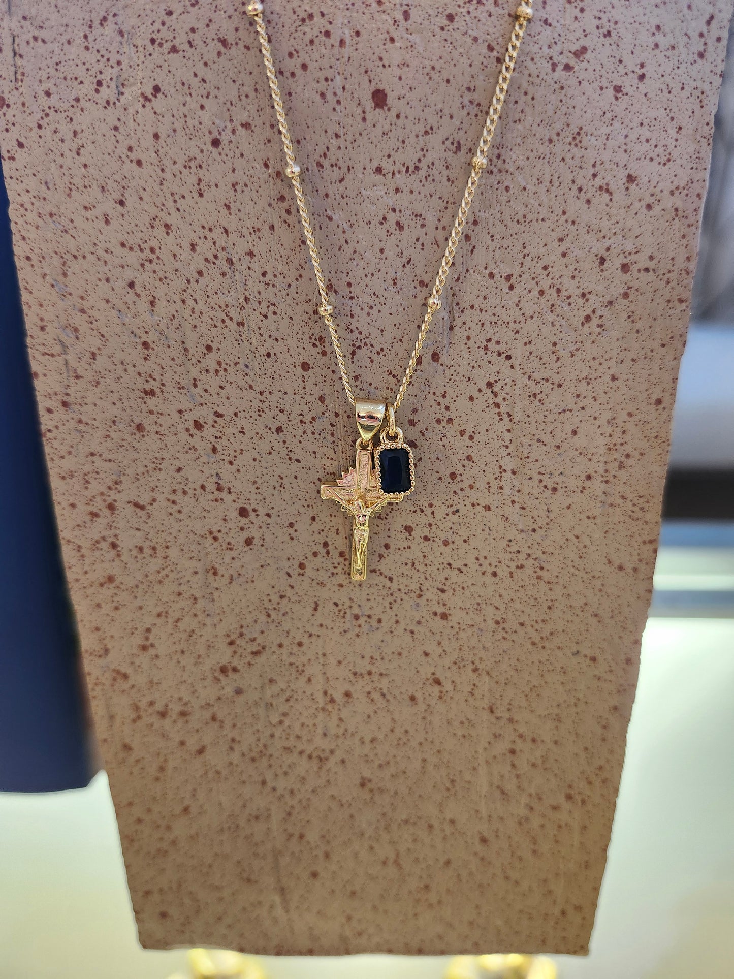 Gold Crucifx with Sapphire Charm