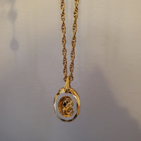 Gold silhouette of Mary Necklace N301