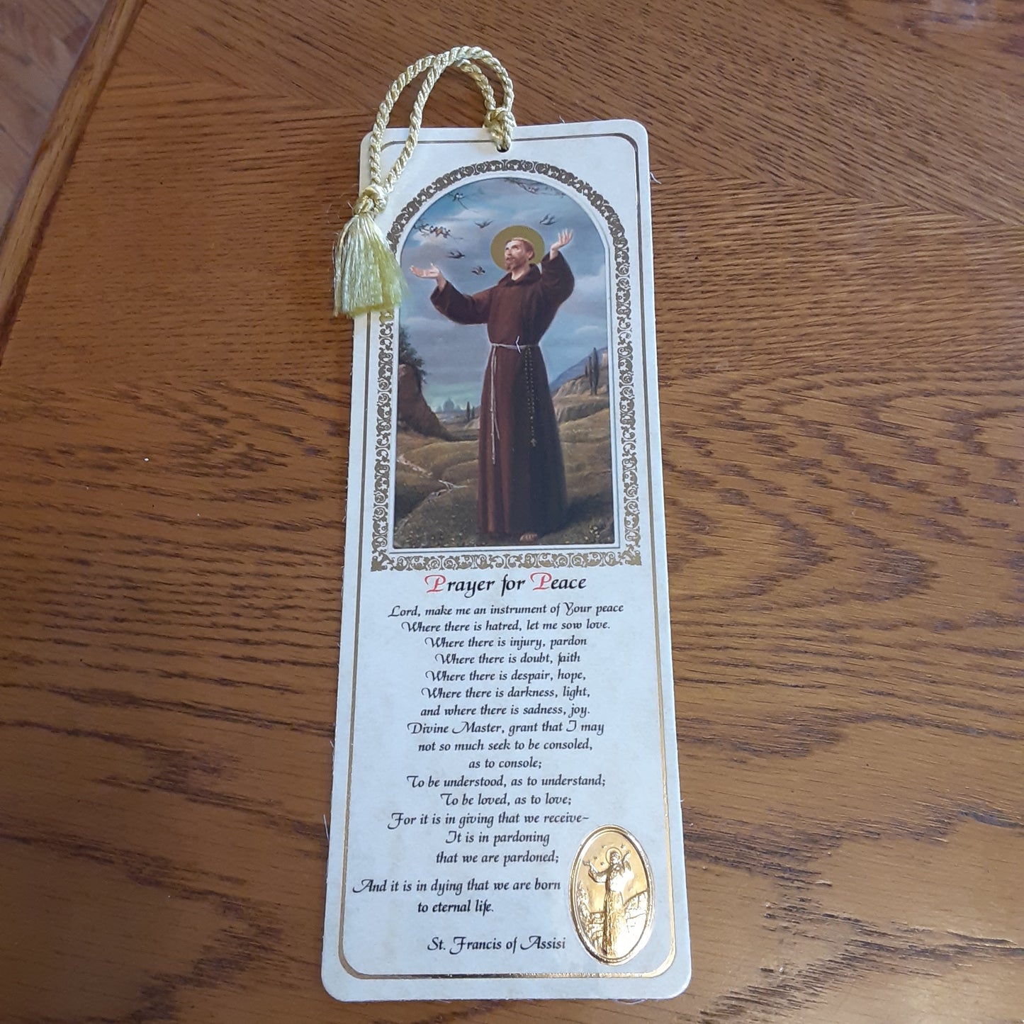 Saint Bookmark with gold embossed medal