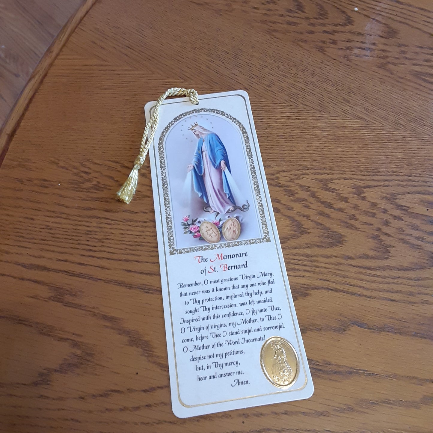 Saint Bookmark with gold embossed medal