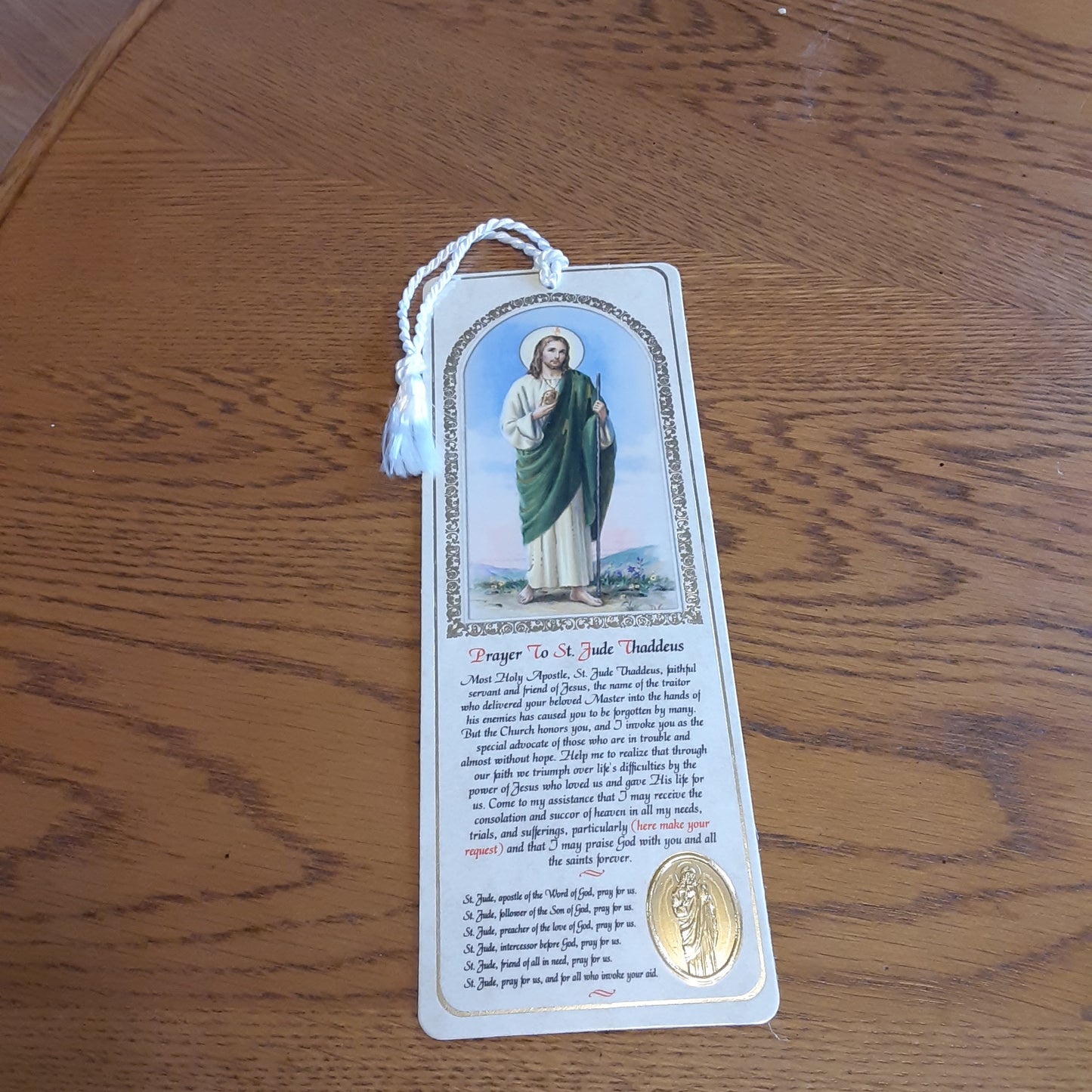 Saint Bookmark with gold embossed medal