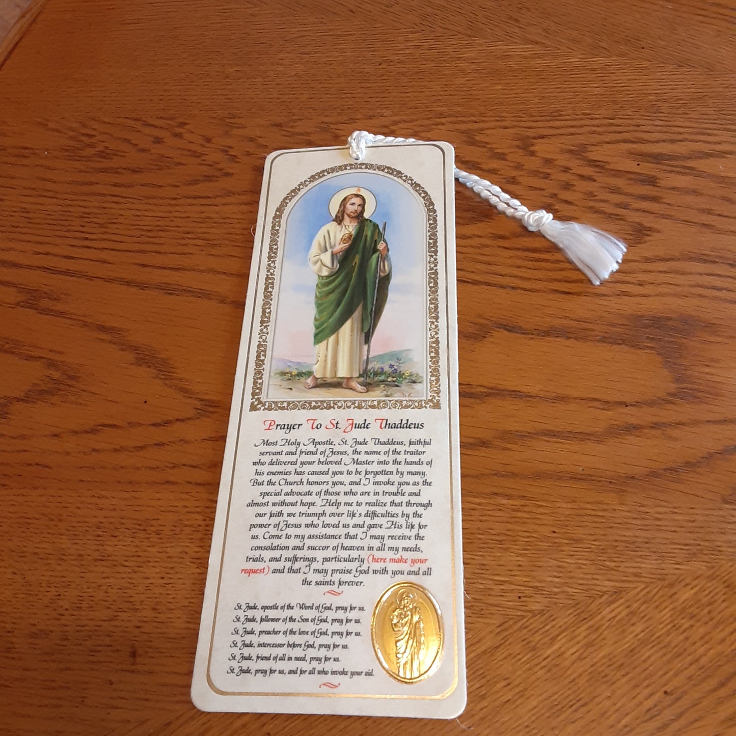 Saint Bookmark with gold embossed medal